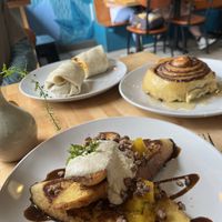 Breakfast burrito, French toast and cinnamon roll!  at Reverie Cafe + Bar in Minneapolis