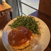 Nashville Hot Chiken Sandwich with dress Arugula.  at Reverie Cafe + Bar in Minneapolis