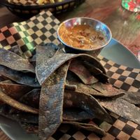 The cheese sauce for the chips was great. Fries in the background had dill spice but weren’t super flavourful despite that.   at Lucky Pig - Paradise Palms in Edinburgh