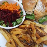 Crispy bbq burger with fries and salad at MeeT in Gastown in Vancouver