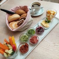 breakfast "Kleeblatt" with margarine, spreads, jam, fruit salad, veggie sticks & one coffee included (17.50€) - pictured bread/rolls are meant for 2 breakfasts at Cafe Glück in Fulda
