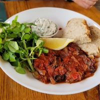 Eggplant in tomatosauce, bread, tzatziki, salad without dressing … 14,50€  at Cafe De Ceuvel in Amsterdam