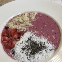 Yogurt with almond, strawberries, chia seeds and coconut flakes  at BIOrganic Raw Cafe in Chisinau