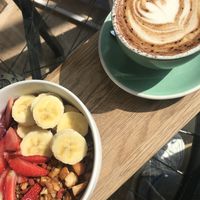 Acai bowl and macadamia nut milk cappuccino.  at The Grind Coffee Company in Johannesburg