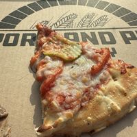 Red sauce, requested BBQ didn’t get it, pickles, tomato + mushroom. Under cooked at the center    at Portland Pie Company in Brunswick