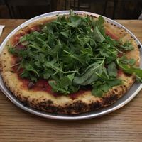 Pepperoni pizza with greens at Double Zero in New York City