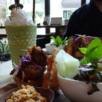 chicken and waffles with peanut sauce and a matcha shake  at Veganerie Concept - Benjasiri Park in Bangkok