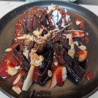 Waffle with ice cream, chocolate and strawberry sauces at Veganerie Concept - Benjasiri Park in Bangkok