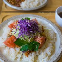 Vegan taco rice (front) and curry rice (behind) with side soups. at Musubi Cafe in Kyoto