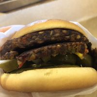 Double vegan patty burger with pickles, onions, and jalapeños  at Elevation Burger in Rye Brook