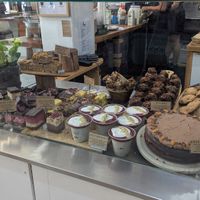 Cabinet food with vegan options labeled at Hapi in Napier
