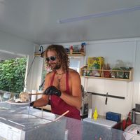 Gyros guy preparing food during heatwave at The Green Market Berlin in Berlin