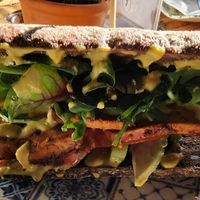 This was marinated tofu sandwich with curry cream sauce. at Kaffestuen Vesterbro in Copenhagen