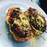 Savoury lentils, sourdough bruchetta, cashew creme, nut parmesan, fermented herbs.  at Ground Earth in Woolgoolga
