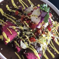 Enfrijoladas con puré de plátano 💚✌🏿 at La Pitahaya Vegana in Mexico City