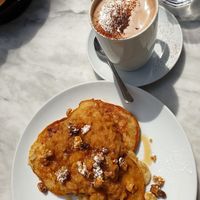 Oat pancakes with cinnamon apples and walnuts and hot chocolate at Cafe Van Gogh in South West London