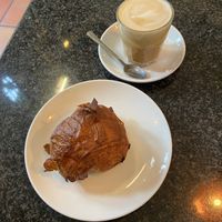 Pain au chocolat and latte  at Cafe Van Gogh in South West London