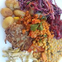 potato pancakes, beans, chickpeas,  couscous salad,  red cabbage salad, baked potatoes at Lepione in Wroclaw