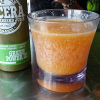 Kumosa! Their signature in house Kombucha and Orange Juice combo. Along with one of their Green Juices. at Choices Cafe in Miami