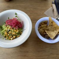 Guacamole 🥑 with pickled onions, toasted corn and cilantro sprouts 🌱   at Vegamo Centro in Mexico City