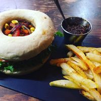 Bbq burger- carrot, pumpkin seeds, flax and caramelized peppers and onion burge at Vegamo Centro in Mexico City
