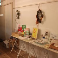 Tiny shop inside Babel Cafe with right->left things made from organic cotton, hand-made jewellery and boxes for cake to take away. at Babel Cafe in Osaka