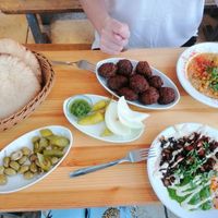 2 different types of hummus, falafel and flatbreads at The Hummus of Tahini in Jerusalem