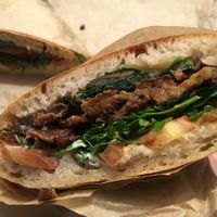 Grilled tempeh sandwich on ciabatta with added arugula and tomatoes- best grilled tempeh sandwich around!! at Good Earth Natural Foods in Mill Valley
