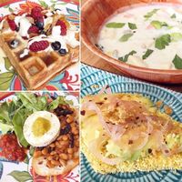 Vegan brunch! 'Ulu chowder with avocado, pickled shallots on polenta toast; cinnamon cardamom mochiko waffle with candied orange, maple creme fraiche, and berries; baked beans and shiitake bacon on sourdough toast with tomato jam, tofu faux egg, Kolea Farm greens. at Juicy Brew - Kaimuki in Honolulu