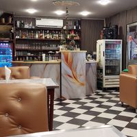 Indoor seating with a/c and strong smell of cigarette! at Martin's House of Indian Food in Paramaribo