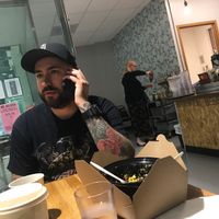 Cool cats eating and rocking their phones at Rabbits Cafe in Portland