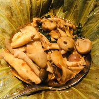 Mushrooms cooked in lotus leaf with fresh pepper berries at Hum Vegetarian - District 1 in Ho Chi Minh City