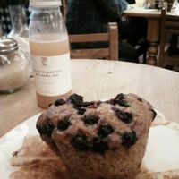 Blueberry muffin and apple juice at Le Pain Quotidien - Sablon in Brussels