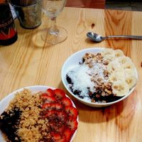 Açai bowls with strawberries, flax seeds and peanut crumble & with bananas, coconut and granola at Almalibre Acai Bar in Valencia