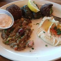 veggie combo plate: hummus, eggplant salad, dolma (rice wraps), falafel, and non vegan sauce (has milk) at Hummus Mediterranean Cuisine in San Mateo