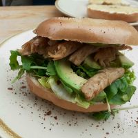 Chicken and avocado bagel with rocket and salsa verde mayo at Hyde Park Book Club in Leeds
