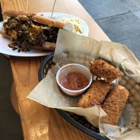 Steak and cheese sandwich with mozzarella sticks at The Butcher's Son in Berkeley