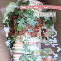 Their new menu with the vegan wet burrito  at OM Foods in Chico