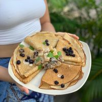 Kapha Crêpes - heavenly thin pancakes with grilled pineapple, blueberries and a sprinkle of mint.  at One Yoga Cafe in Koh Phangan