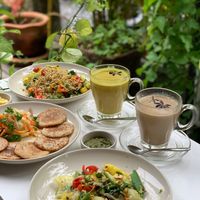 An ensemble of our favorite dishes - Ayu-Trix pancakes, paella and chai latte! All vegan, all beyond tasty!  at One Yoga Cafe in Koh Phangan