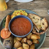 sausage, mushroom, sautéed spinach, scrambled tofu (so good!!!!), potatoes, tomato and sourdough   at Mildreds - Kings Cross in North London