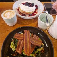 I had a chai latte, pea and avocado smash on focaccia with rashers added. My friend had the berry pancakes and a latte. (breakfast menu) at Mildreds - Kings Cross in North London