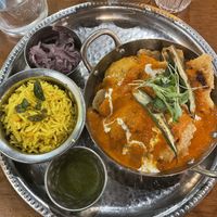 Mahkani tofu - “creamy rich tomato cashew curry, organic tofu, spiced cauliflower & okra, lemon chana pilau rice, laccha pyaaz, mint chutney"  at Mildreds - Kings Cross in North London