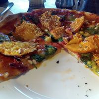 Roasted pumpkin pizza with vegan cheese at Kai Whakapai Cafe and Bar  in Wanaka