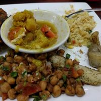Dilled potatoes, pakoras, mixed veg.,veg. rice pilaf, and chixkpea salad. at Shahi Foods in Austin