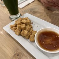 Crispy tofu bites appetizer and herbal lemonade   at Seitan Urban Bistro in Lima