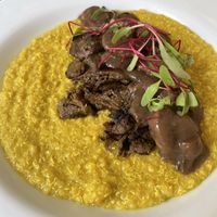 Quinotto al aji amarillo, seitan medallions & mushrooms saucee  at Seitan Urban Bistro in Lima