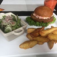 Seitan burger with slaw, REALLY GOOD crispy fresh cut fries. at Seitan Urban Bistro in Lima