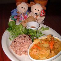 Yellow curry dinner with Thai iced tea.  
(Teddy Bears not included with dinner, although one seems to be making off with my spring roll.) at Vegan Plate in Studio City