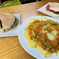 Bocadillo de setas, papas con mojo, choripan  at La Alpargata in Madrid